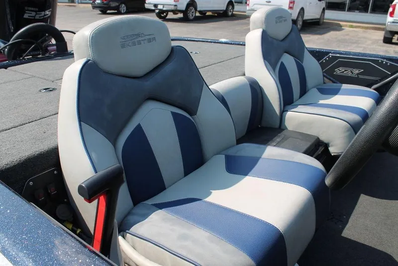 Slide: The Image of 2021 Skeeter ZX225 boat interior with blue and gray seats, showcasing sleek design. - 7