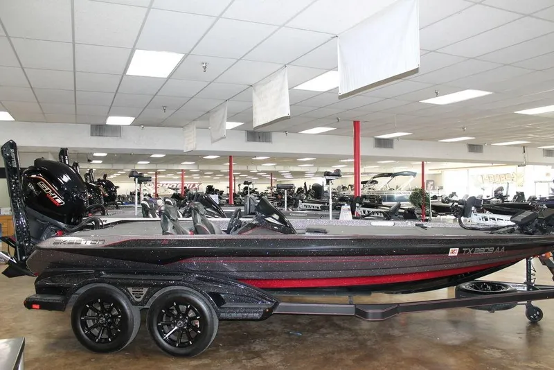 The Image of 2025 Skeeter FXR21L boat displayed in a showroom with sleek design and modern features. - 0
