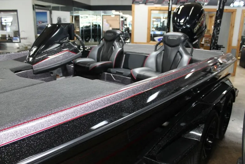 Slide: The Image of 2025 Skeeter FXR21L boat interior with sleek black and red design. - 1