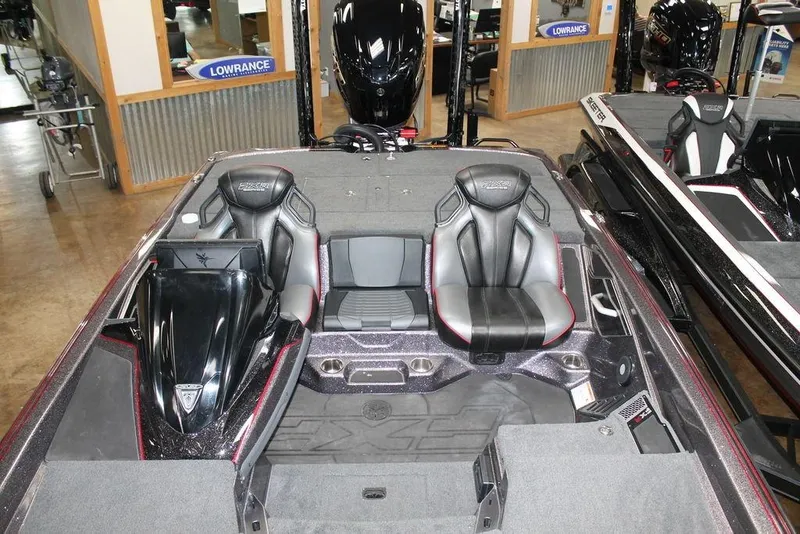Slide: The Image of 2025 Skeeter FXR21L boat interior with dual seats and advanced dashboard. - 11