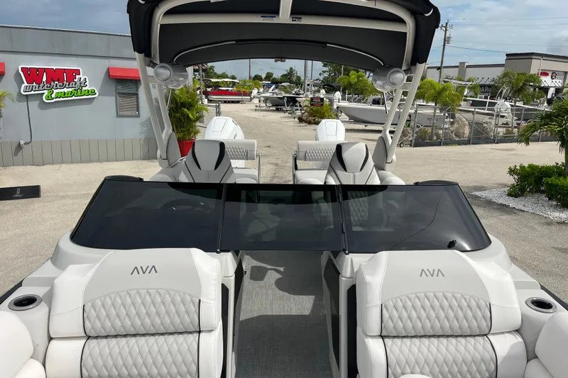 Slide: The Image of 2026 Avalon 2785 Excalibur LTD boat with windshield, quad lounger, twin Mercury 400hp engines. - 19