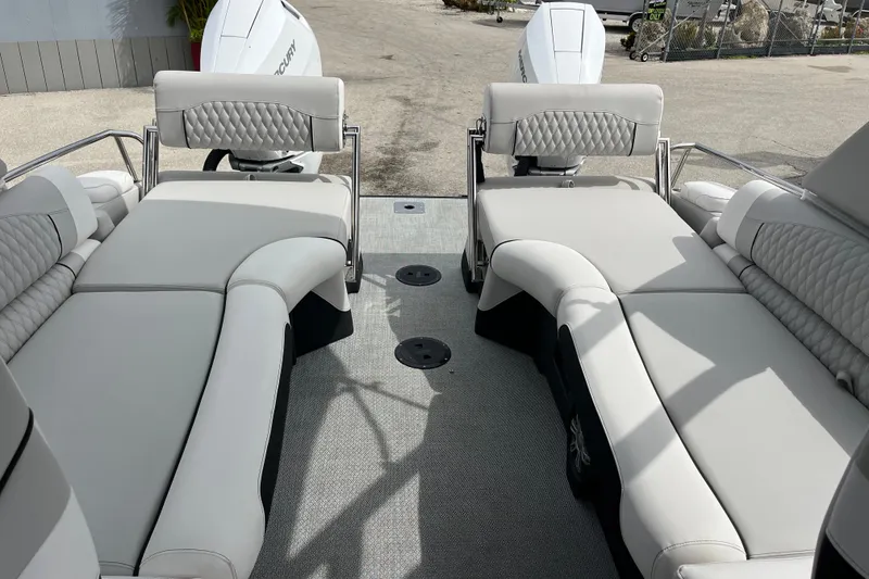 Slide: The Image of Luxurious Avalon 2785 Excalibur LTD boat interior with plush seating and twin Mercury 400hp engines. - 22