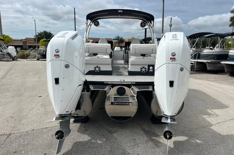 Slide: The Image of 2026 Avalon 2785 Excalibur LTD boat with twin Mercury 400hp V-10 engines, rear view. - 6