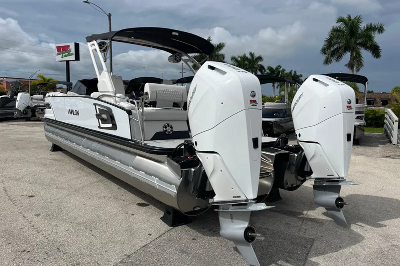 Slide: The Image of 2026 Avalon 2785 Excalibur LTD boat with twin Mercury 400hp V-10 engines, parked outdoors. - 7