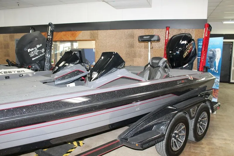 Slide: The Image of 2025 Skeeter FXR21 Apex boat in showroom, featuring sleek design and modern features. - 10