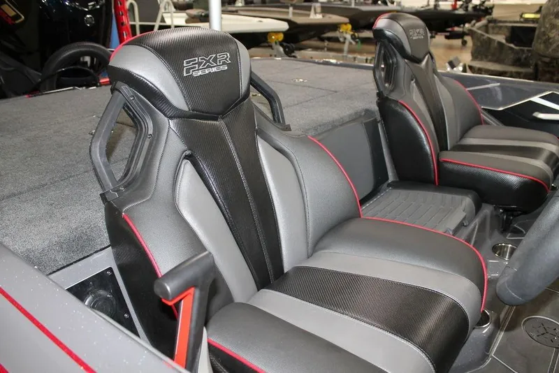 Slide: The Image of 2025 Skeeter FXR21 Apex boat seats with sleek black and red design. - 4