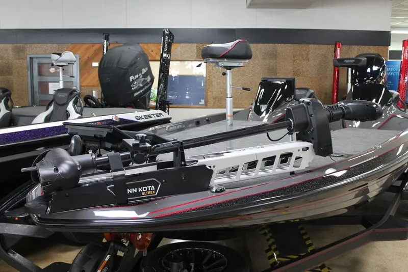 Slide: The Image of 2025 Skeeter FXR21 Apex boat with Minn Kota Ultrex trolling motor in showroom. - 5
