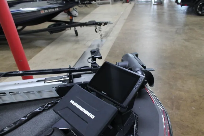 Slide: The Image of 2025 Skeeter FXR21 Apex boat with Humminbird electronics in a showroom. - 6