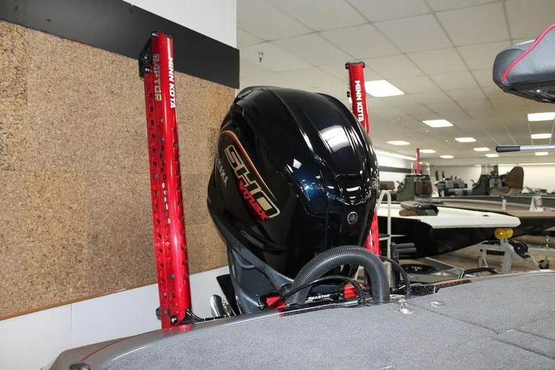 Slide: The Image of 2025 Skeeter FXR21 Apex boat with Minn Kota accessories in showroom. - 9