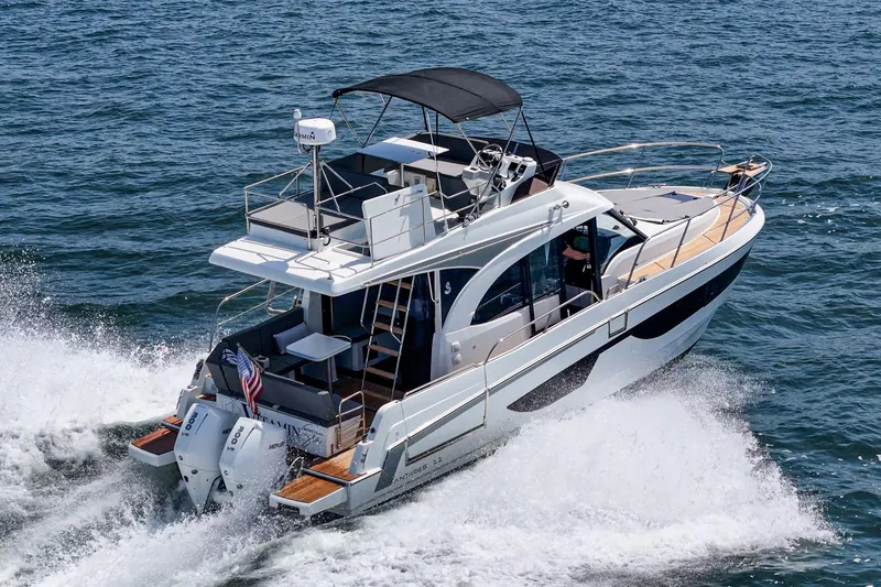 Slide: The Image of 2023 Beneteau Antares 11 Fly cruising on open water, showcasing sleek design and powerful engines. - 12