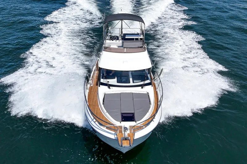 Slide: The Image of 2023 Beneteau Antares 11 Fly cruising on open water, aerial view. - 27