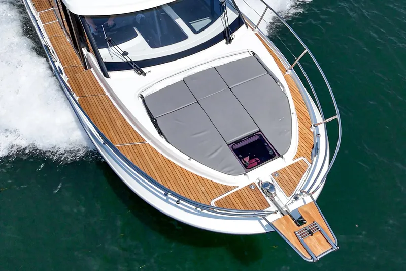 Slide: The Image of 2023 Beneteau Antares 11 Fly cruising on water, showcasing sleek design and spacious deck. - 28