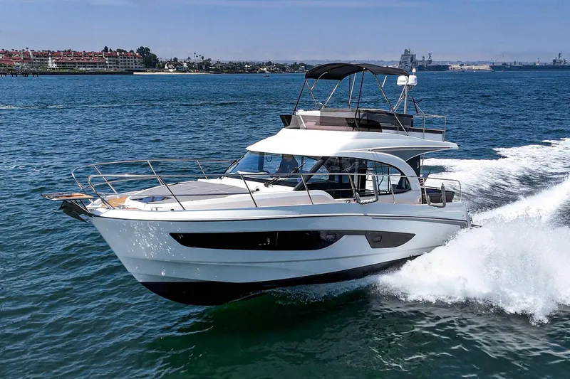Slide: The Image of 2023 Beneteau Antares 11 Fly cruising on open water, showcasing sleek design and performance. - 3