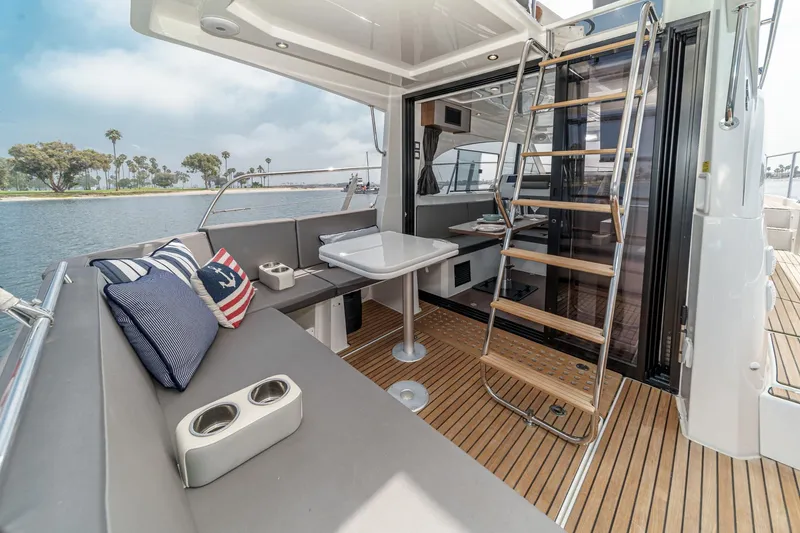 Slide: The Image of 2023 Beneteau Antares 11 Fly yacht interior with seating, table, and stairs. - 31