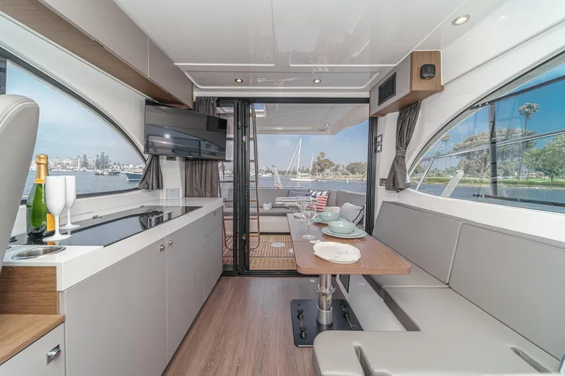Slide: The Image of Interior of 2023 Beneteau Antares 11 Fly yacht with modern kitchen and dining area. - 41