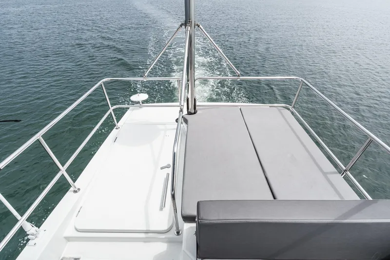 Slide: The Image of 2023 Beneteau Antares 11 Fly deck view, featuring sleek design and open water backdrop. - 55