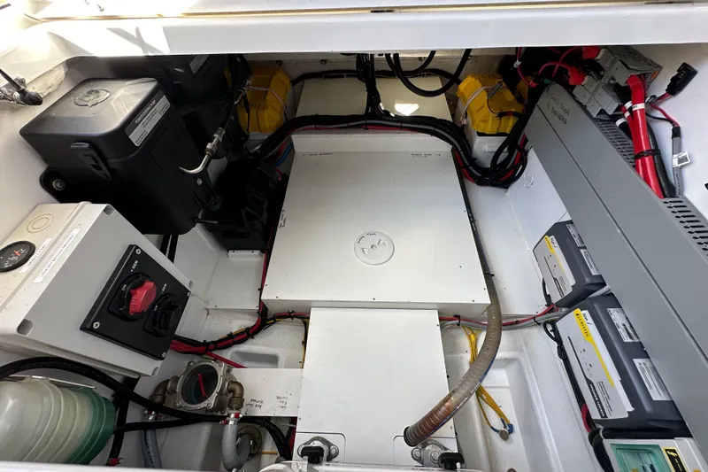 Slide: The Image of Engine compartment of 2023 Beneteau Antares 11 Fly, showcasing electrical components and wiring. - 68