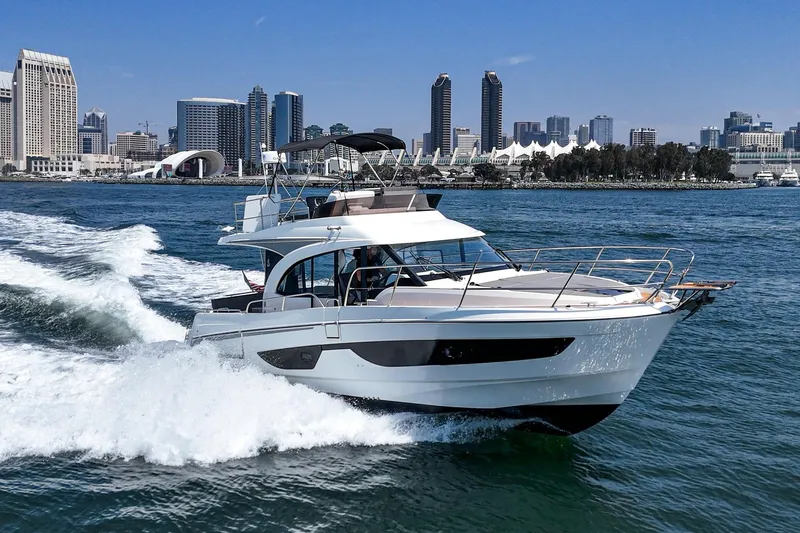 Slide: The Image of 2023 Beneteau Antares 11 Fly cruising in urban waterfront setting. - 7