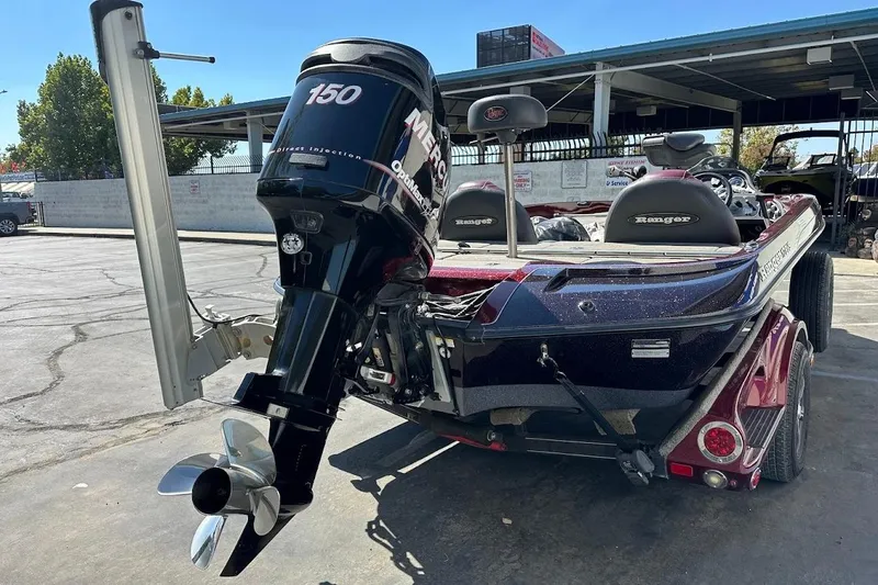 Slide: The Image of 2010 Ranger 178 VS boat with Mercury 150 outboard motor, parked outdoors. - 11