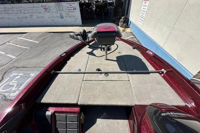 Slide: The Image of 2010 Ranger 178 VS boat deck with trolling motor in a parking area. - 19
