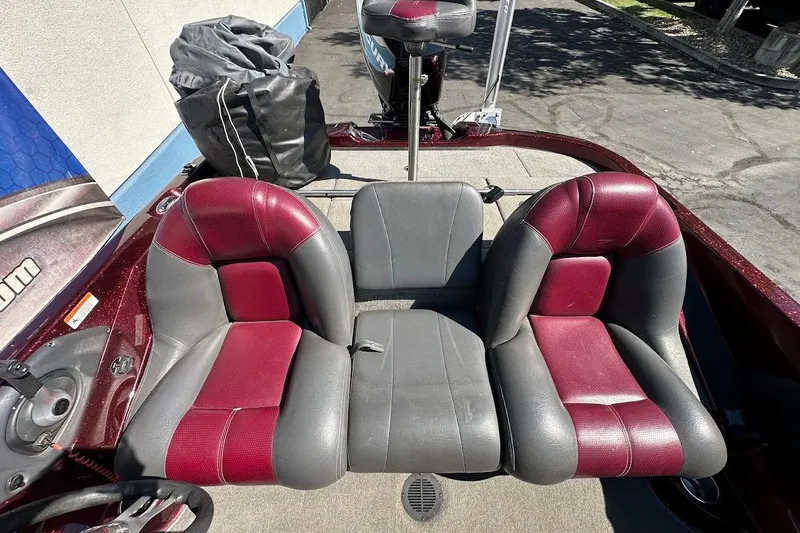Slide: The Image of 2010 Ranger 178 VS boat interior with red and gray seating. - 28