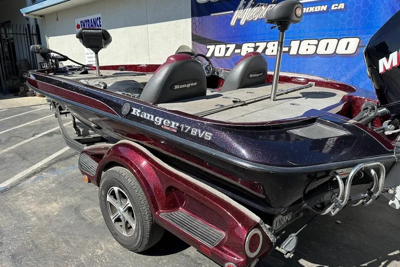 Slide: The Image of 2010 Ranger 178 VS boat on trailer, parked outside a building. - 8
