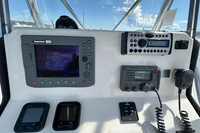 Slide: The Image of 2007 Edgewater 245CC boat dashboard with Raymarine GPS, radio, and control panels. - 3