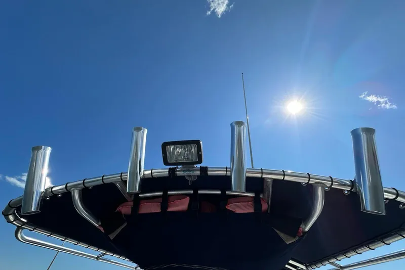 Slide: The Image of Edgewater 245CC boat top view under clear blue sky, 2007 model. - 30