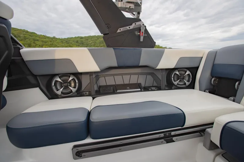 Slide: The Image of 2021 Malibu Wakesetter 23 MXZ interior with premium seating and built-in speakers. - 14