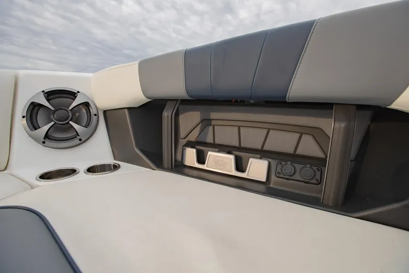 Slide: The Image of 2021 Malibu Wakesetter 23 MXZ interior with speaker and cup holders. - 24