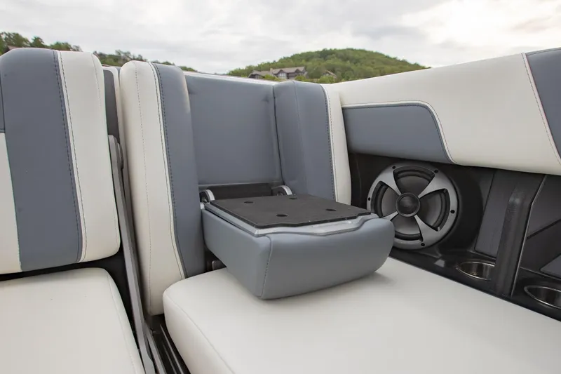 Slide: The Image of 2021 Malibu Wakesetter 23 MXZ interior seating with speaker and cup holders. - 26
