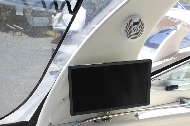 Slide: The Image of Interior of 2005 Sea Ray 300 Sundancer with TV and speaker system. - 11