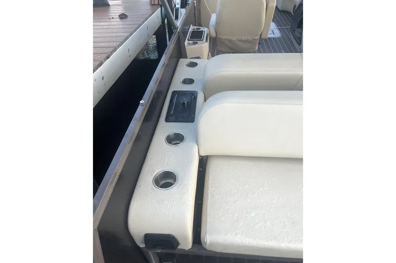 Slide: The Image of Luxurious interior of 2022 Premier Solaris 230 pontoon boat with plush seating. - 12