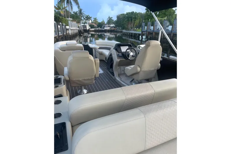 Slide: The Image of Luxurious interior of 2022 Premier Solaris 230 boat with plush seating. - 13
