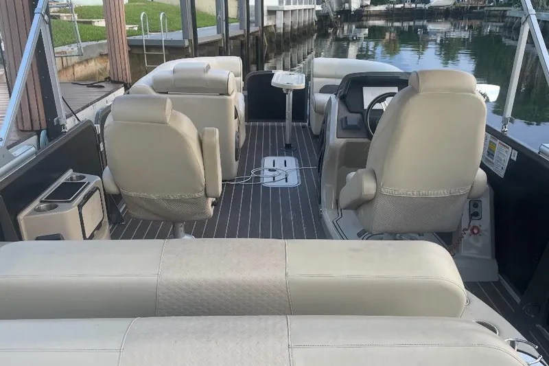 Slide: The Image of Premier Solaris 230 boat interior console with cup holders and speaker, 2022 model. - 27