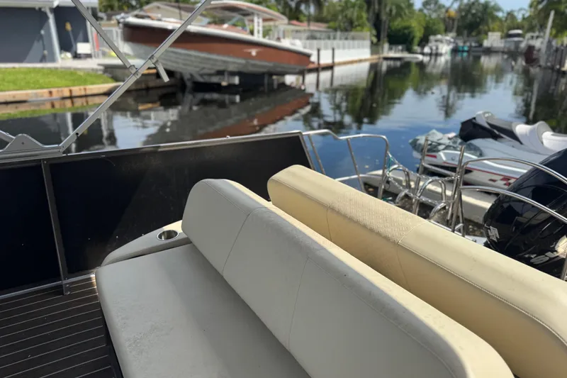 Slide: The Image of Docked Yamaha jet ski beside Suzuki outboard motor on Premier Solaris 230, 2022. - 35