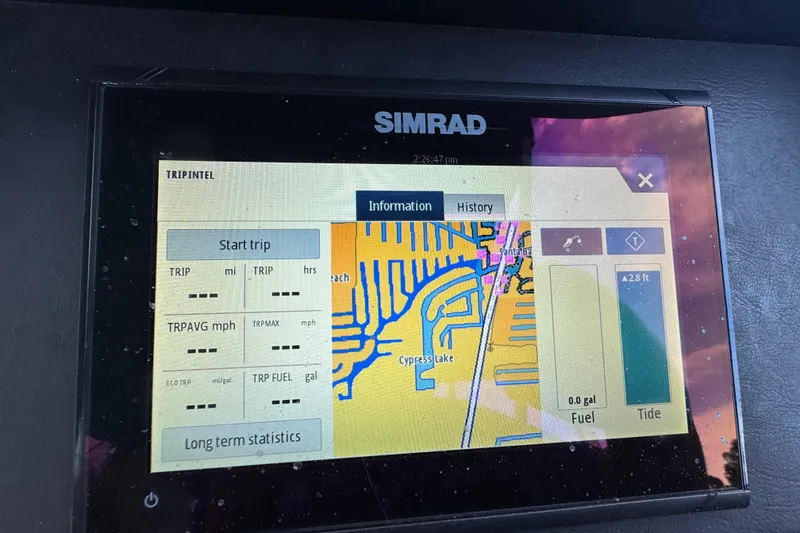 Slide: The Image of 2022 Premier Solaris 230 pontoon boat with beige seating, docked on calm water. - 37