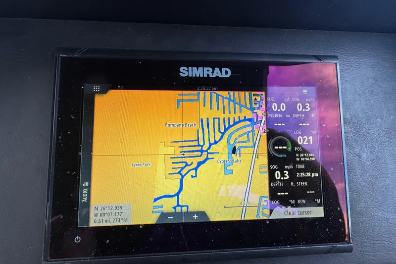 Slide: The Image of Simrad navigation display on Premier Solaris 230, 2022 model, showing trip and map data. - 41