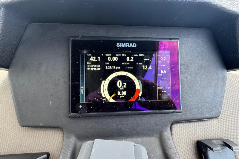 Slide: The Image of Simrad navigation display on 2022 Premier Solaris 230 boat, showing map and speed data. - 43
