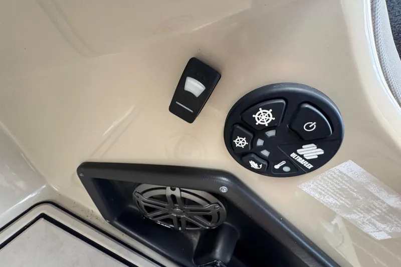 Slide: The Image of Premier Solaris 230 boat interior with beige seating, cup holders, and sanitizer bottle, 2022 model. - 52