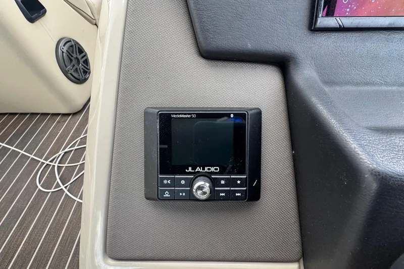 Slide: The Image of Open storage compartment on 2022 Premier Solaris 230 boat, containing ropes and equipment. - 54