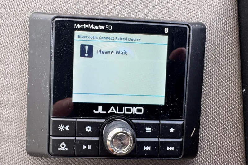 Slide: The Image of Control panel of 2022 Premier Solaris 230 boat with various switches and ports. - 61