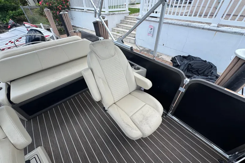 Slide: The Image of Premier Solaris 230 boat interior, 2022 model, featuring beige seating and striped flooring. - 69