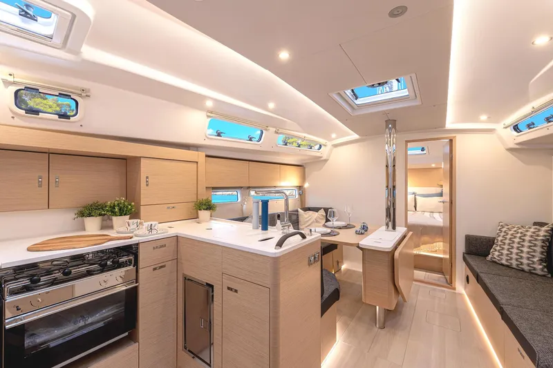Slide: The Image of Luxurious interior of 2025 Hanse 360 yacht with modern kitchen and seating area. - 29