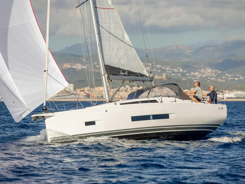 Slide: The Image of 2025 Hanse 360 #41 sailing on open water with two people onboard. - 5