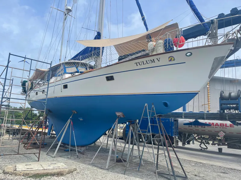 Slide: The Image of 1977 Aleutian 51 sailboat, named Tulum V, on dry dock for maintenance. - 2