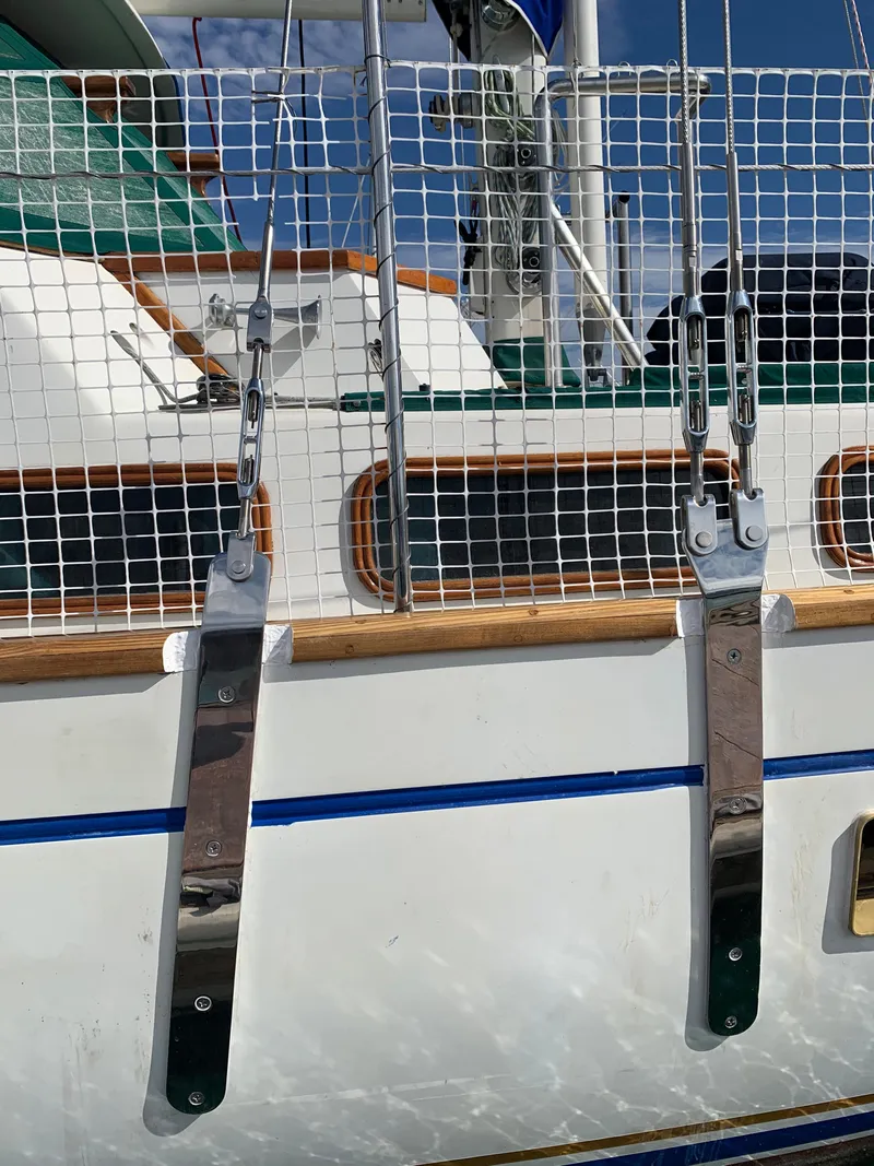 Slide: The Image of 1977 Aleutian 51 sailboat with stainless steel rigging and netting on deck. - 26