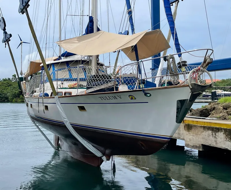 Slide: The Image of 1977 Aleutian 51 sailboat docked, featuring classic design and sturdy build. - 3