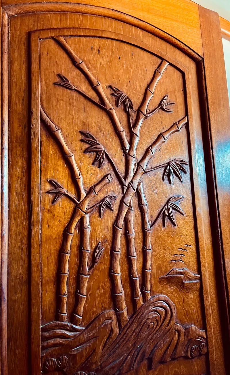 Slide: The Image of Wooden door with intricate bamboo carving, Aleutian 51, 1977 model. - 49