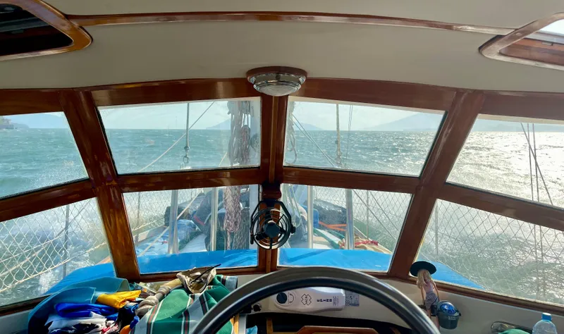 Slide: The Image of Interior view from a 1977 Aleutian 51 sailboat cockpit, overlooking the ocean. - 6